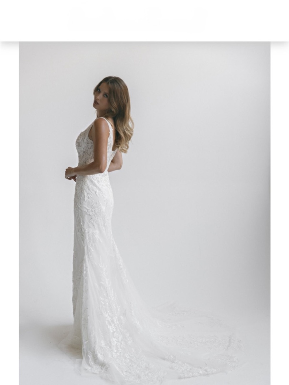 Elegant White Lace Wedding Gown with Train